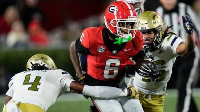 Georgia wide receiver Dominic Lovett (6) runs against Georgia Tech defensive back Warren Burrell (4) during the first half of an NCAA college football game, Friday, Nov. 29, 2024, in Athens, Ga. (Mike Stewart/AP)