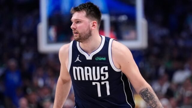 Dallas Mavericks guard Luka Doncic brings the ball up court against the Boston Celtics during Game 4 of the NBA finals, June 14, 2024. (AP Photo/Julio Cortez)